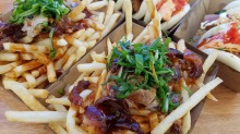 Peking duck loaded fries from Bao Stop at the Night Noodle Markets.