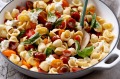 Orrechiette with cherry tomatoes, basil and pine nuts.