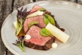 Local grass-fed beef is on the menu at Homage restaurant, Hidden Vale.