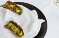 Prawn taco with sweet, poached meat and whipped avocado in a sesame and pepita shell.