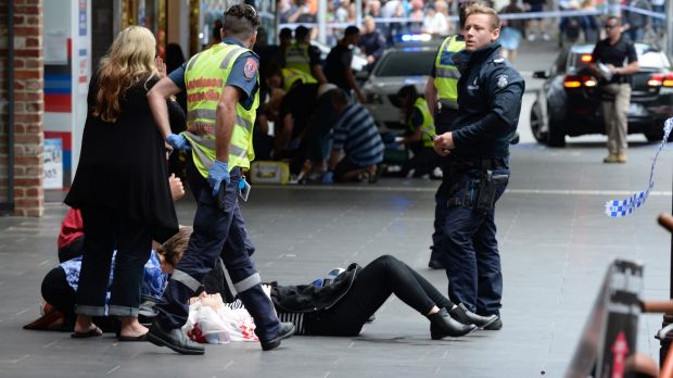 Police and paramedics with an injured pedestrian