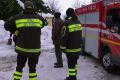 Rescuers wait next to a fire truck in Abruzzo on Thursday morning.