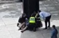 Police treating a person in Melbourne's CBD.