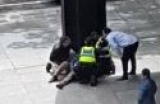 Police treating a person in Melbourne's CBD.