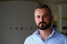 BRISBANE, AUSTRALIA - JANUARY 19: Clint Luna controls his electric Tesler P900 Model S vehicle and reposit home energy ...