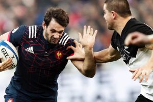 Dane Coles sizes up Remi Lamerat at the Stade de France in November.