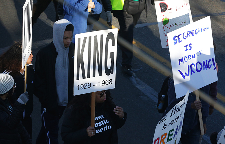 Demonstrators march and chant as they walk down Rainier Avenue during Seattle Parks and Recreationâ€™s Teen Programâ€™s 12th annual MLK youth march held on Saturday, January 14, 2016.  According to Seattle.gov, “Teens from throughout the city will speak out against injustice via a peaceful demonstration. The goal for the march is to celebrate the contributions Seattle youth make in creating a better city and to honor the work that youth do to keep Dr. Kingâ€™s dream alive every day.”