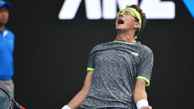 Denis Istomin of Uzbekistan celebrates his win against Djokovic.