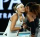 Serena Williams shakes hands at the net after victory in her second round match against Lucie Safarova