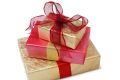 GENERIC. PLEASE CREDIT IMAGE: iStockphoto Three presents wrapped in gold and red. Isolated on white Gold and Red ...
