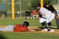Melbourne's Cody Jones slides back into first base as Boss Moanaroa reaches for the ball.