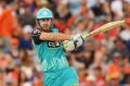 Missing you already: Chris Lynn hits lustily for the Heat.