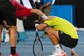 Switzerland's Stan Wawrinka, left, checks on Slovakia's Martin Klizan after he was struck by the ball.