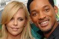 From left, actors Charlize Theron, Jason Bateman and Will Smith make an appearance on MTV's "Total Request Live" show, ...