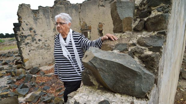 Laura Bell walks through the ruins at the Aborginal Mission station at Lake Condah in 2015.