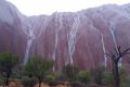 Waterfalls stream down Uluru after record rains.