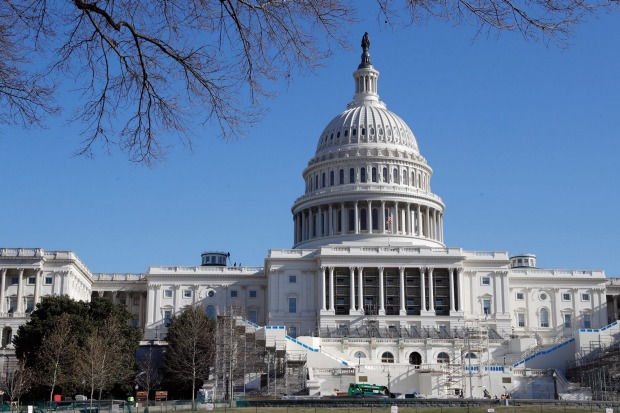 Work continues on Wednesday on the stand for the inauguration of President-elect Donald Trump on the west front of the ...