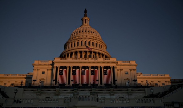 American flags hang outside the US Capitol in Washington, DC in preparation for Donald Trump's inauguration.