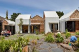 Tower House in Melbourne, by architect Andrew Maynard, is a cluster of several small houses forming one family home. 