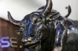 A bronze bull statue stands at the entrance to the Bombay Stock Exchange (BSE) building in Mumbai, India, on Tuesday, ...