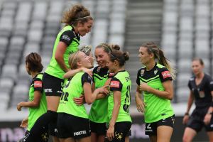 Canberra United celebrate a goal.