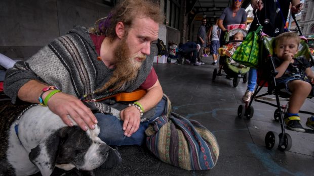 Glen, 32, with his dog, Tonka, at the Flinders Street Station camp.