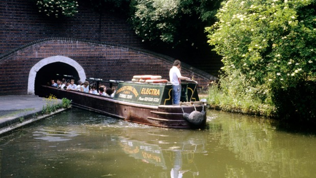 Barges at the Dudley Black Country Museum in England allow visitors to explore rock formations, limestone mines, branch ...