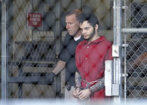 Esteban Santiago leaves the Broward County jail for a hearing in federal court, Tuesday, Jan. 17, 2017, in Fort Lauderdale, Fla.