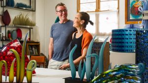 Glass artists husband and wife team, Matt Curtis and Harriet Schwarzrock, in their studio in Queanbeyan.