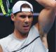 MELBOURNE, AUSTRALIA - JANUARY 11: Raphael Nadal of Spain hits a forehand during a practice session ahead of the 2017 ...