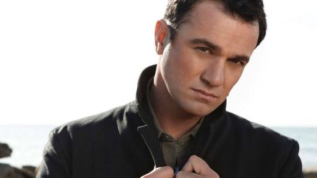 Singer Shannon Noll was arrested outside an Adelaide strip club.