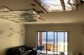 A patched-up ceiling in a new townhouse in South Morang, where water crashed through the ceiling during the December 29 ...