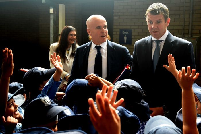 New South Wales Premier Mike Baird (right) and Minister for Education Adrian Piccoli in a crowd of students