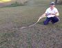 Sunshine Coast Snake Catcher Richie Gilbert holding up a coastal carpet python retrieved from a home at Lake McDonald