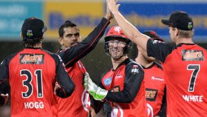 BRISBANE, AUSTRALIA - JANUARY 20: Renegades players celebrate taking the wicket of Jack Wildermuth of the Heat during ...
