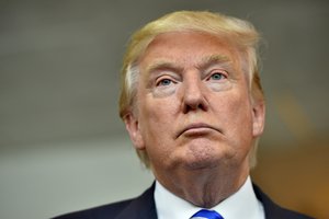 In this Thursday, Aug. 27, 2015, photo, Republican presidential candidate Donald Trump listens during a news conference after speaking at the TD Convention Center, in Greenville, S.C. Trump's call for mass deportation of millions of immigrants living in the U.S. illegally, as well as their American-born children, bears similarities to a large-scale removal that actually happened to many Mexican-American families 85 years ago.