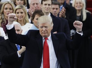 President Donald Trump pumps his fist after delivering his inaugural address after being sworn in as the 45th president of the United States during the 58th Presidential Inauguration at the U.S. Capitol in Washington, Friday, Jan. 20, 2017.