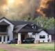 Fire crews were battling the blaze threatening homes at Coolum.