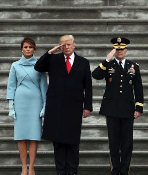 President Donald Trump with first lady Melania Trump and Major General Bradley Becker review troops in Washington.