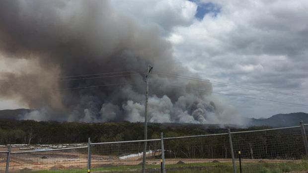 The Coolum bushfire continues to rage on Friday, as seen from the Peregian Springs water tower.