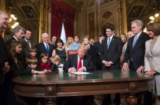 President Donald Trump is joined by the Congressional leadership and his family as he formally signs his cabinet ...