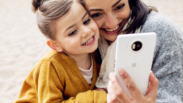 Mother and daughter taking a selfie with Lumia 950 XL
