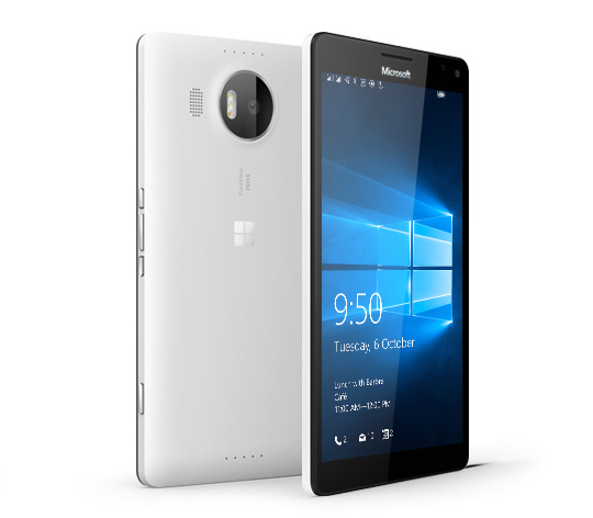 Two white Lumia 950  XL phones with one facing backward and the other facing forward with Windows 10 lock screen 
