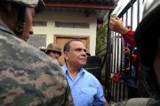 Radio and TV Globo journalist David Romero (C), leaves the court in Tegucigalpa, on November 13, 2015 after being found guilty of six charges of defamation