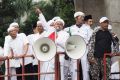 Indonesian police have denied that they are afraid to take on Habib Rizieq, seen here flanked by his supporters at ...