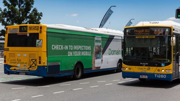 Give way signs are plastered on the back of Brisbane's buses.