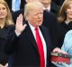 Donald Trump is sworn in as the 45th president of the United States as Melania Trump looks on.