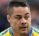 Changing frame: Jarryd Hayne in Eels colours in 2014 and during his NFL sojourn.