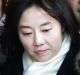 South Korean Culture Minister Cho Yoon-sun, center, leaves the Seoul Central District Court in Seoul after attending a ...