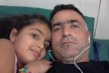 Sam Nemati (R) with his daughter Aisya.